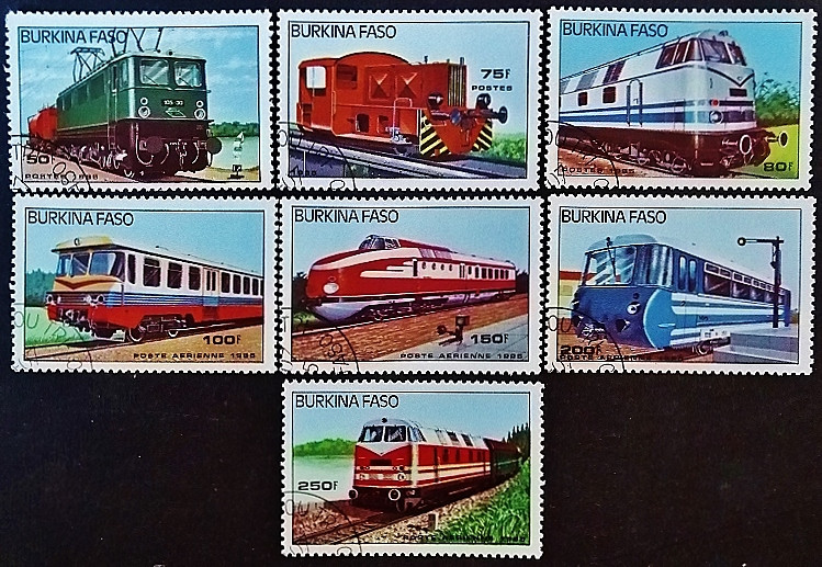Набор почтовых марок (7 шт.). "Локомотивы". 1985 год, Буркина-Фасо.